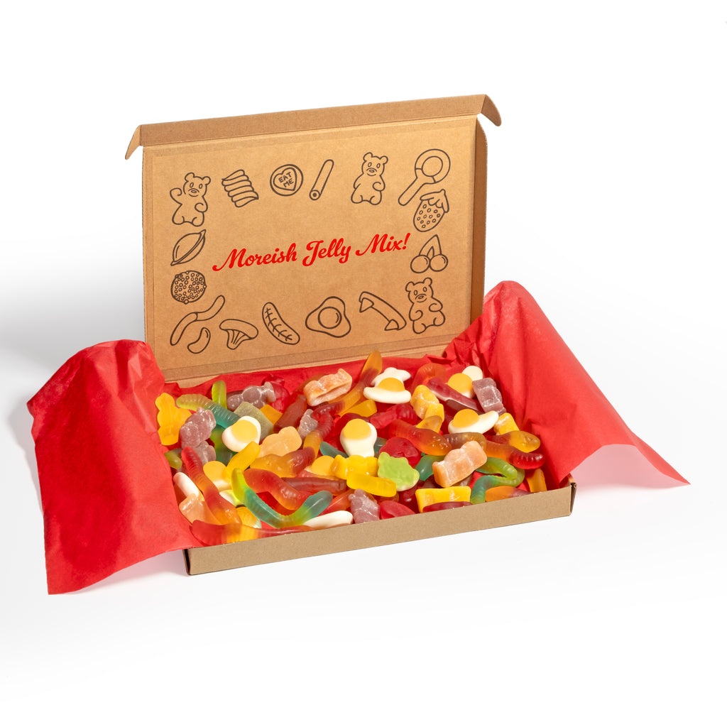 Gift box of gummy jelly sweets with a decorative lid inscribed with a sign, set against a white background.
